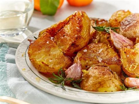 crispy-garlic-roast-potatoes-recipe-food-network image