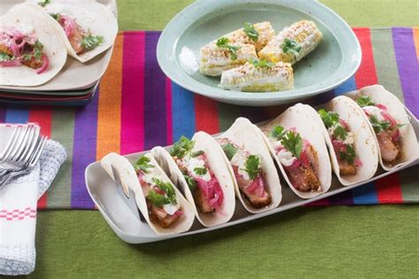 spiced-pork-tacos-with-crema-pickled-onion-elote image
