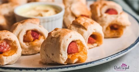 pigs-in-a-blanket-with-cheese-and-dipping-sauce image