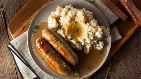 a-guinness-gravy-smothered-bangers-mash image