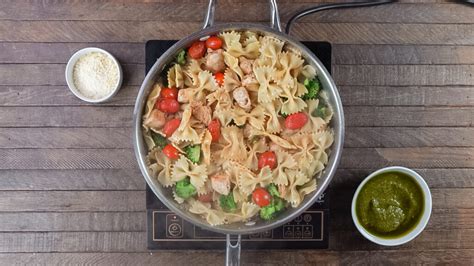 chicken-pesto-pasta-with-broccoli-the-wanderlust-kitchen image