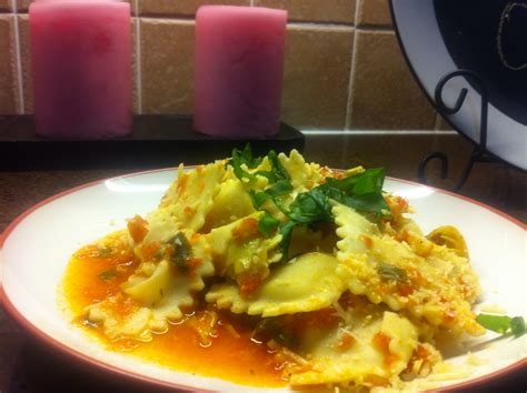 cheese-ravioli-with-fresh-tomato-and-artichoke-sauce image