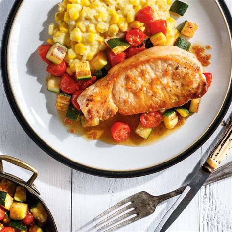 pork-chops-with-creamed-corn-and-cherry-tomatoes image