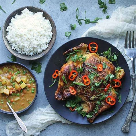 oven-roasted-whole-curry-chicken-with-vegetables image