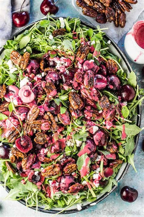 arugula-and-fresh-cherry-salad-with-candied-pecans image