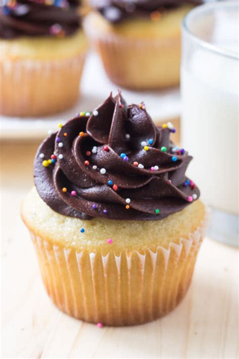 yellow-cupcakes-with-chocolate-frosting-just-so-tasty image