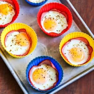 baked-eggs-in-canadian-bacon-cups-kalyns-kitchen image
