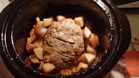 crock-pot-cheeseburger-meatloaf-with-baked-potatoes image