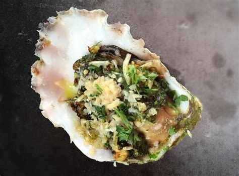 a-broiled-oyster-with-gp-hazelnut-pesto-at-shelter image
