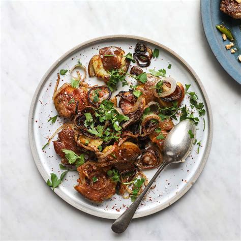crispy-smashed-potatoes-with-fried-onions-and-parsley image
