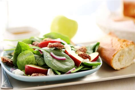 spinach-salad-with-apple-vinaigrette-recipe-the-spruce image