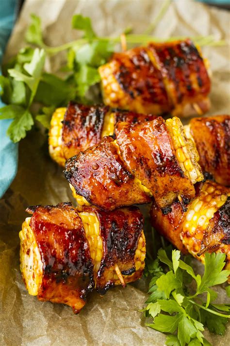 sweet-spicy-grilled-bacon-wrapped-corn-on-the-cob image