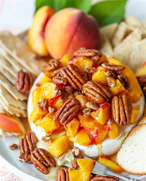 easy-and-delicious-peach-pecan-baked-brie-pizzazzerie image
