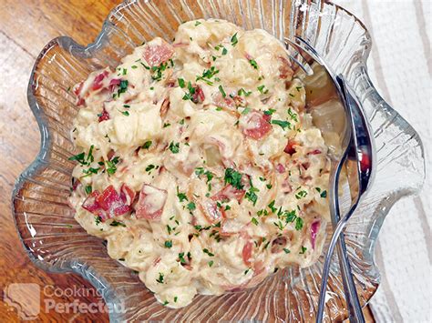 caramelized-onion-potato-salad-with-bacon-cooking image