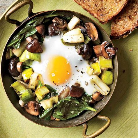 eggs-baked-over-sauted-mushrooms-and-spinach image