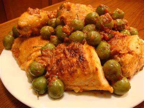 chicken-with-tomatoes-and-olives-recipe-food-republic image
