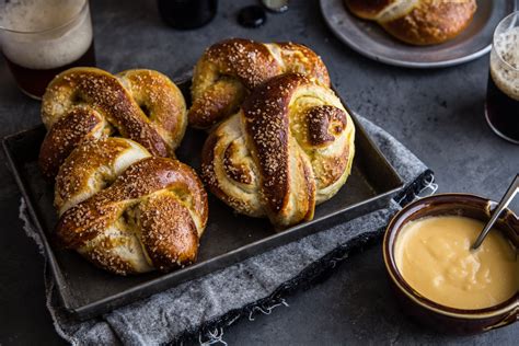 garlic-herb-baked-pretzels-with-cider-cheese-dip-jelly image