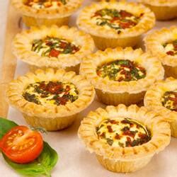warm-goat-cheese-basil-and-roasted-pepper-tarts image
