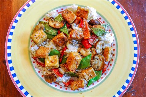 vegan-tofu-stir-fry-with-vegetables-in-peanut-sauce image