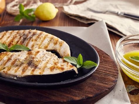 grilled-swordfish-with-lemon-juice-olive-oil-and-herbs image