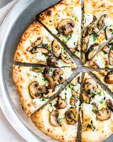 mushroom-pizza-with-fresh-herbs-a-couple-cooks image
