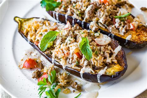stuffed-eggplant-with-garlic-tahini-sauce-the-cozy-apron image