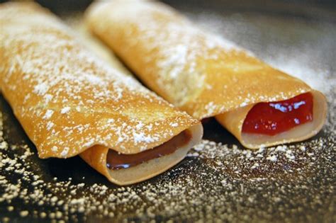 crepes-with-nutella-and-strawberry-filling-eat-at-home image