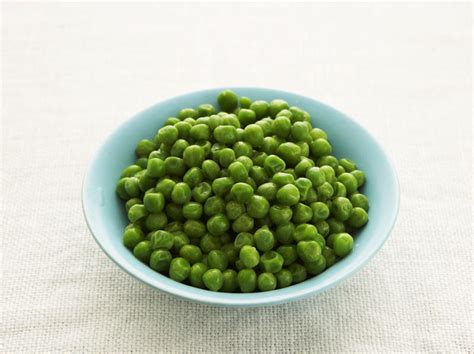baked-peas-with-tarragon-yogurt-and-pistachios image