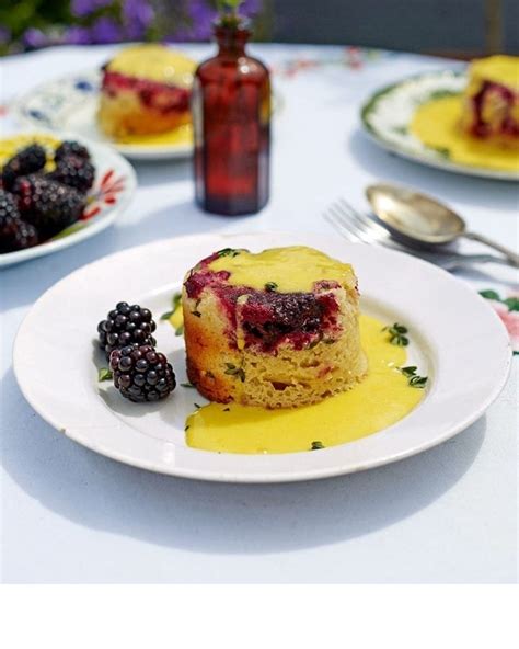 blackberry-and-thyme-steamed-puddings-with-bay-custard image