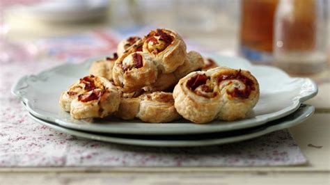 sun-dried-tomato-and-rosemary-palmiers-recipe-bbc-food image
