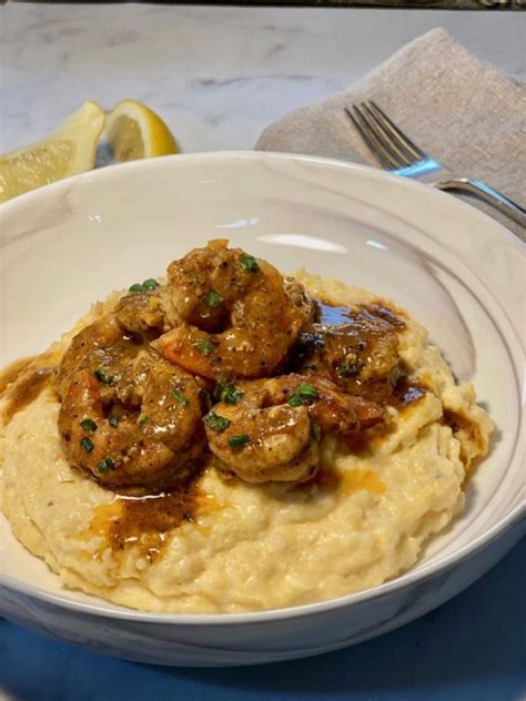 the-best-cajun-shrimps-with-cheddar-cheese-grits-ever image