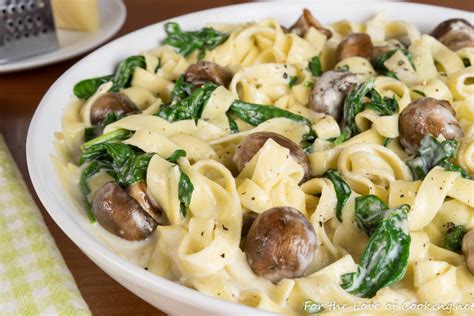 fettuccine-alfredo-with-button-mushrooms-spinach image