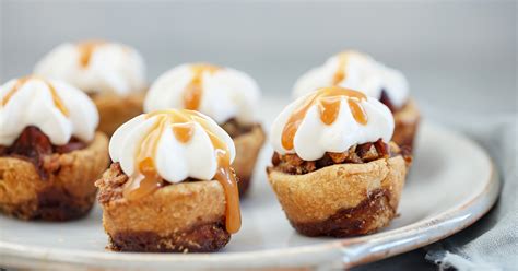 mini-caramel-pecan-pies-with-cinnamon-roll-pie-crust image