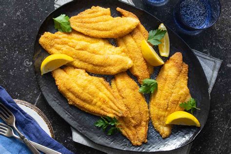 light-and-crispy-pan-fried-catfish-recipe-southern-living image