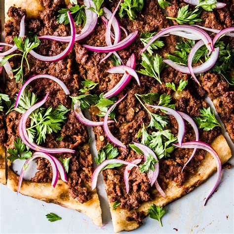 spicy-lamb-pizza-with-parsleyred-onion-salad image