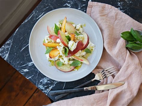 peach-caprese-salad-with-basil-oil-recipe-kitchen image