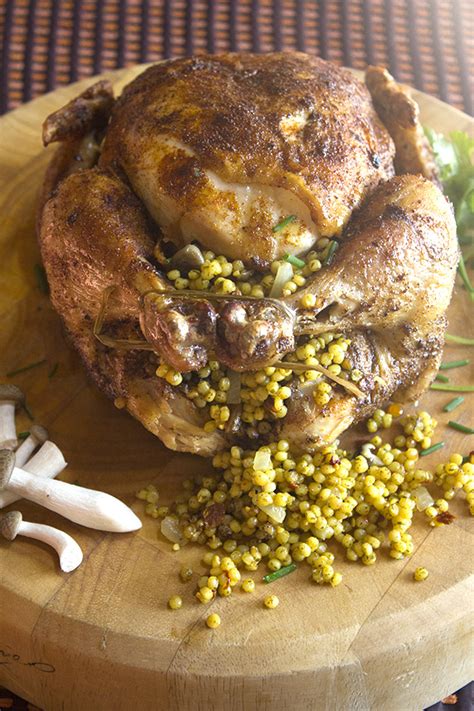moroccan-roast-chicken-with-couscous-stuffing image