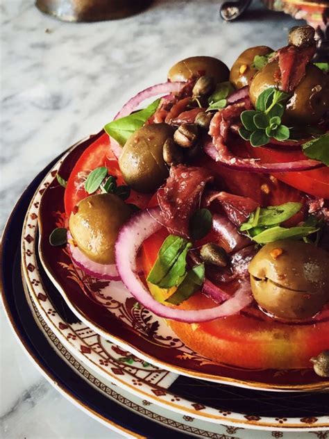 tomato-salad-with-onions-olives-anchovies image