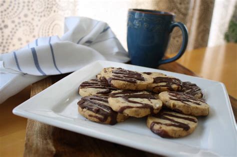 chocolate-dipped-pecan-sandies-recipe-rodelle image