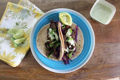 crispy-steak-tacos-with-cilantro-lime-crema-tasty image