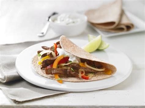 beef-fajitas-with-lime-sour-cream-canadas-food-guide image