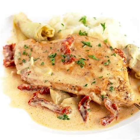 creamy-chicken-with-sun-dried-tomatoes-lemon-blossoms image