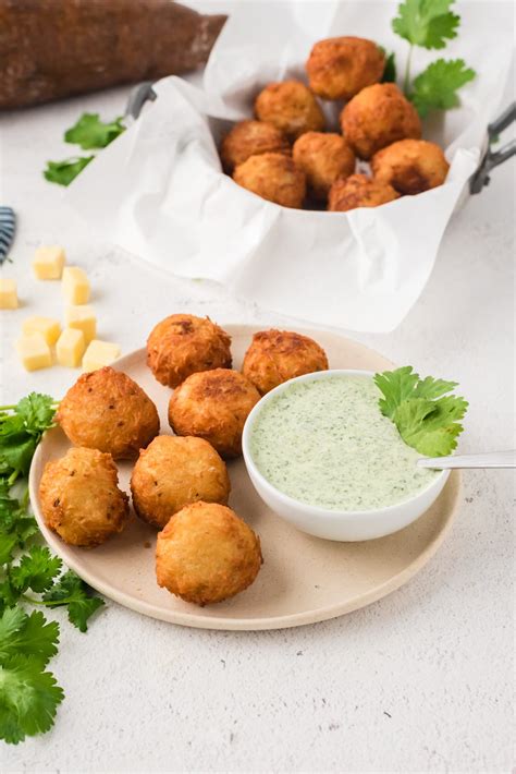cheese-stuffed-fried-yuca-balls-cilantro-dressing image
