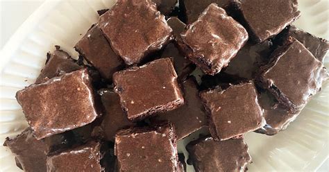 siri-dalys-frosted-chocolate-zucchini-brownies image
