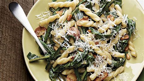pasta-with-dandelion-greens-garlic-and-pine-nuts image