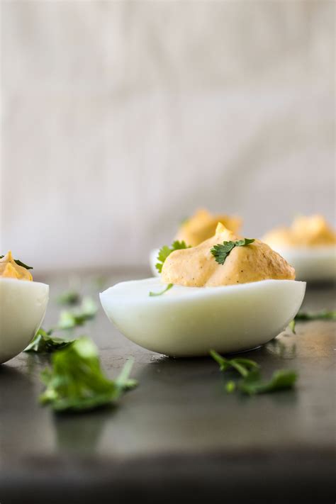 sriracha-deviled-eggs-the-food-charlatan image