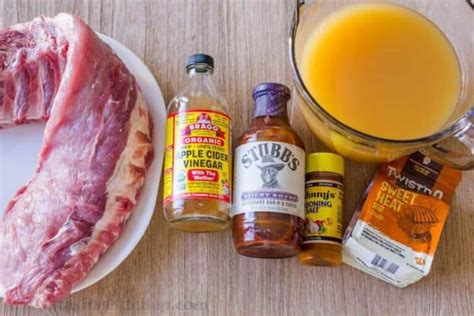 spritzing-ribs-with-apple-cider-vinegar-spraying-ribs image