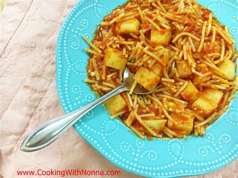 cut-spaghetti-and-potatoes-pasta-e-patate-cooking image