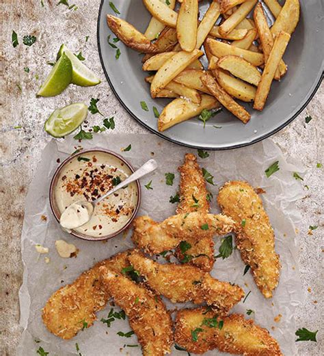 parmesan-crumbed-chicken-strips-with-potato-wedges image