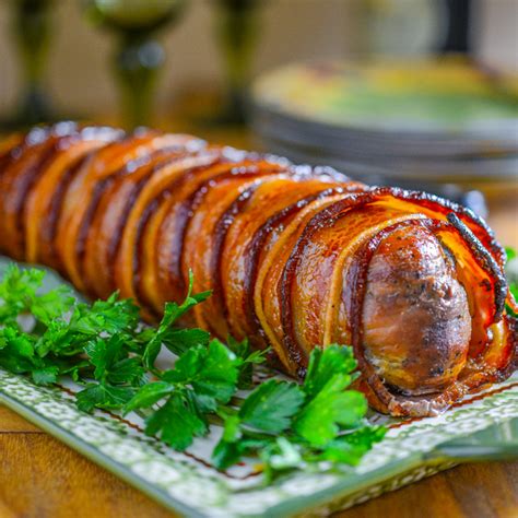 bacon-and-apple-wrapped-pork-tenderloin-with-maple-apple-glaze image